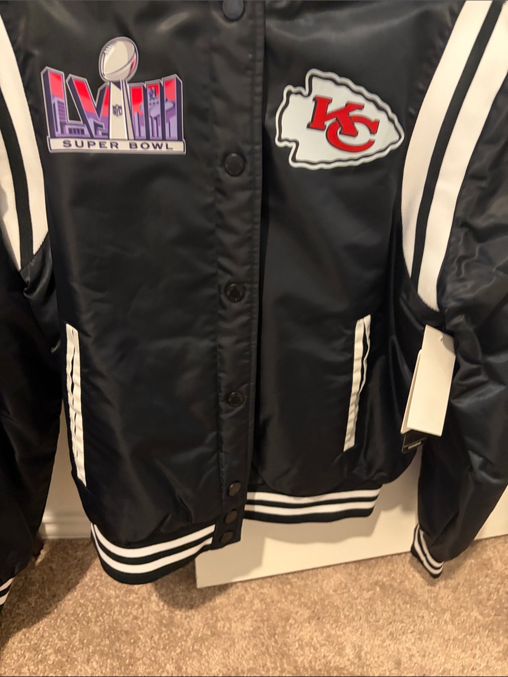 Black Women's Varsity Jacket with White Trim and KC Chiefs Patch